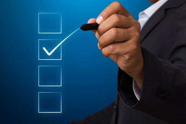 business-man-with-pen-mark-checkbox